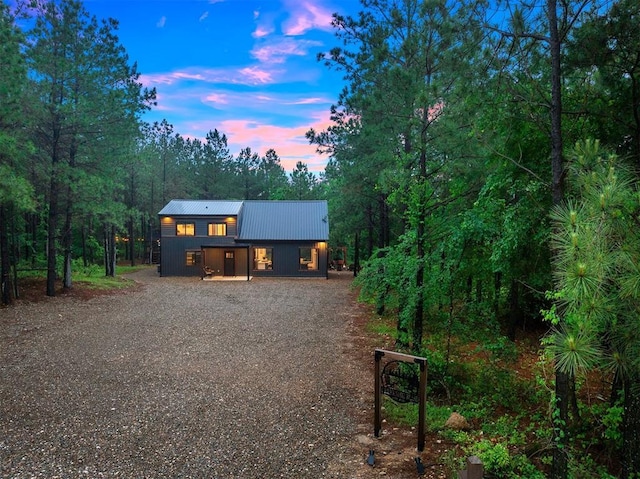 1194 Camp Ranch Rd, Broken Bow, OK 74728 - chalet / cabin featuring gravel driveway, metal roof, and a forest view