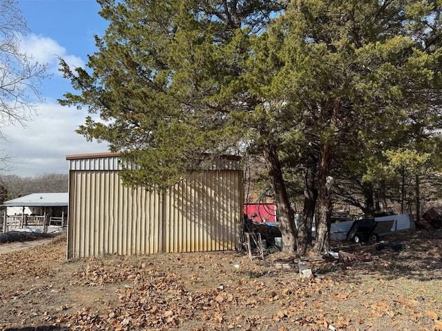 view of home's exterior with an outdoor structure