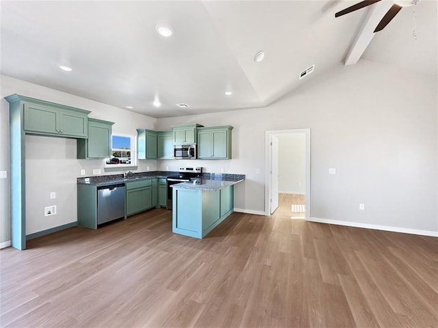 kitchen featuring lofted ceiling with beams, sink, green cabinetry, stainless steel appliances, and light hardwood / wood-style flooring