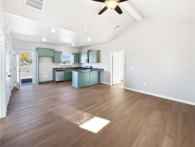 kitchen featuring ceiling fan, appliances with stainless steel finishes, dark hardwood / wood-style floors, and beam ceiling