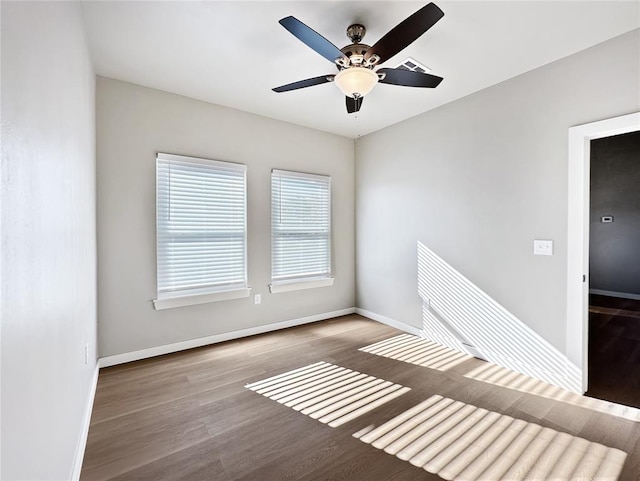 empty room with wood-type flooring and ceiling fan