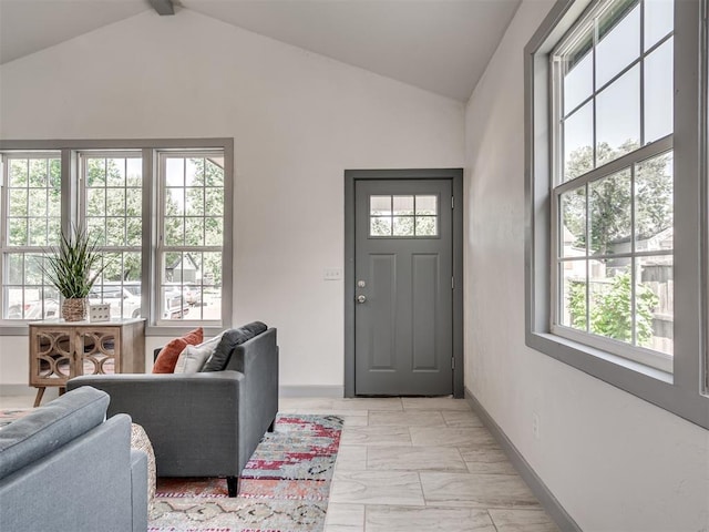 foyer with vaulted ceiling with beams