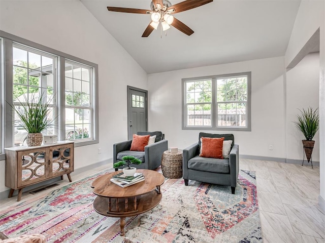 sitting room featuring high vaulted ceiling and ceiling fan