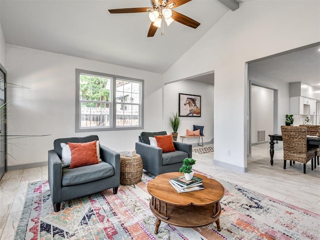 sitting room with ceiling fan, high vaulted ceiling, and beam ceiling