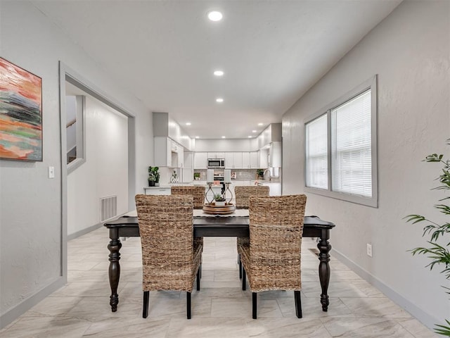 dining room featuring sink