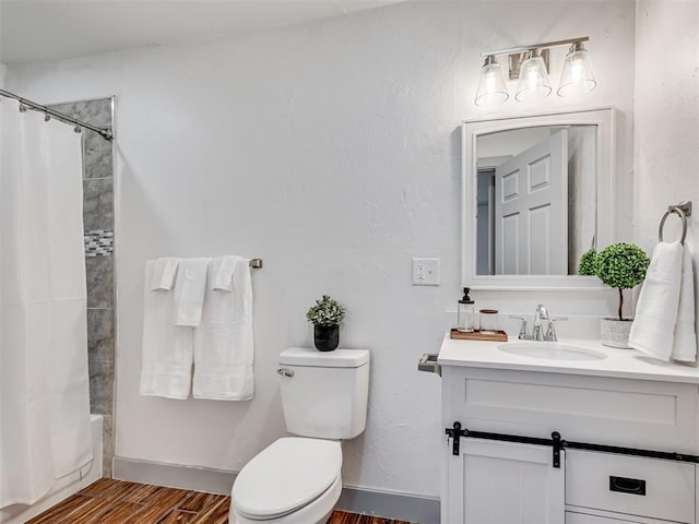 full bathroom featuring wood-type flooring, shower / tub combo with curtain, vanity, and toilet