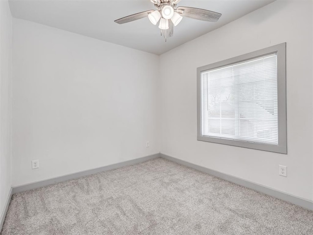 unfurnished room with light carpet and ceiling fan