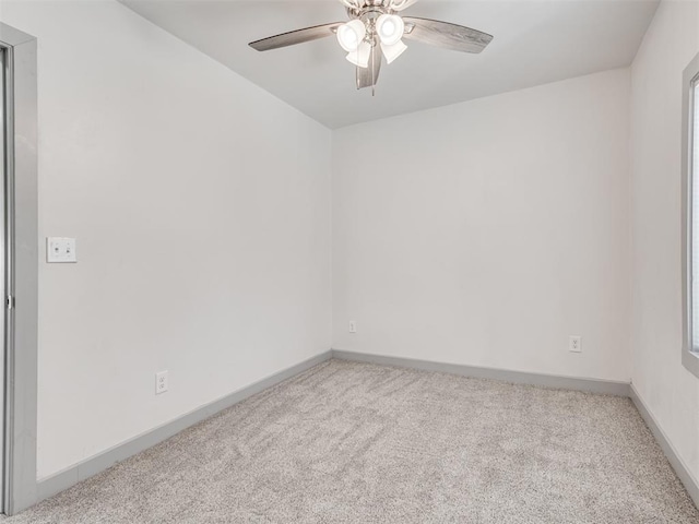 unfurnished room with light carpet and ceiling fan