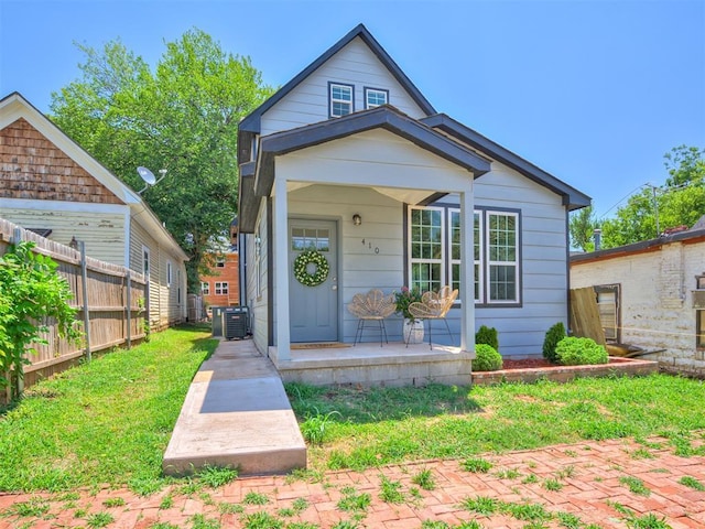 bungalow-style home featuring central AC unit and covered porch