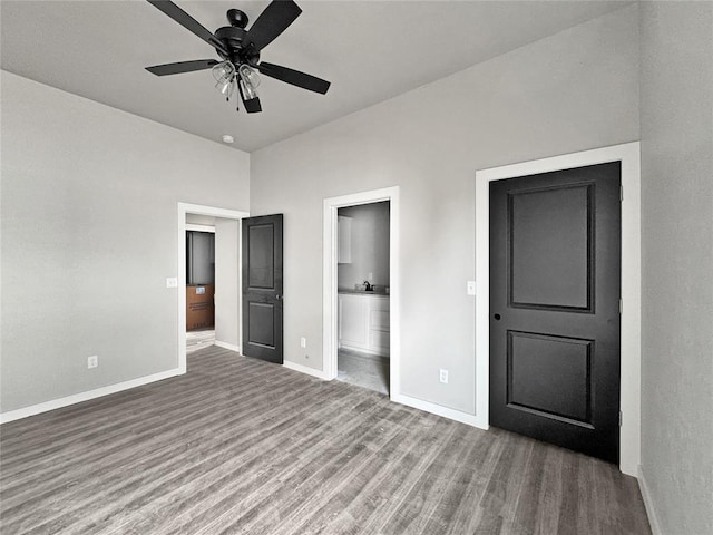 unfurnished bedroom with wood-type flooring, ensuite bathroom, and ceiling fan