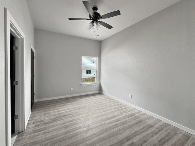 unfurnished bedroom with ceiling fan and light hardwood / wood-style floors