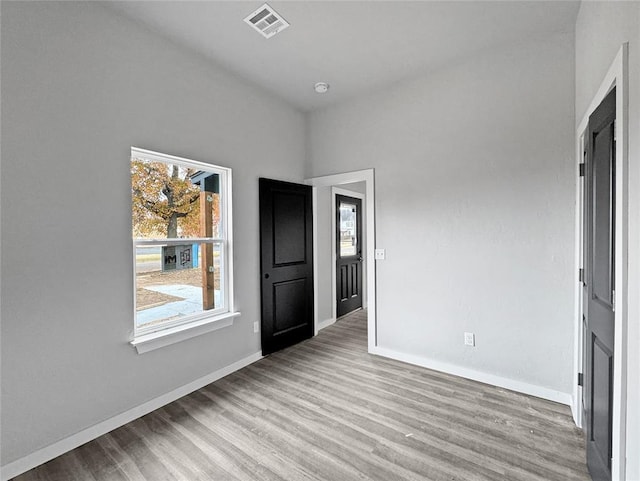 unfurnished room with light hardwood / wood-style flooring