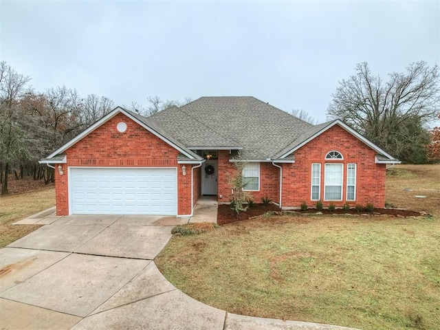 view of front of house with a garage and a front lawn