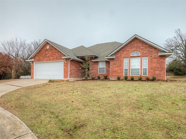 single story home featuring a garage and a front yard