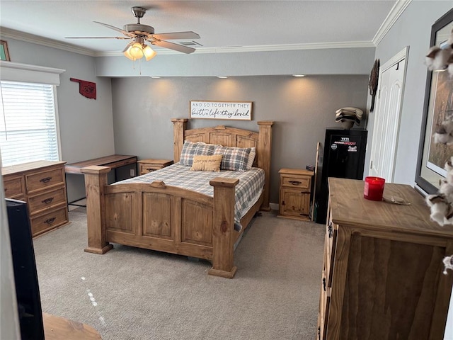 bedroom with ceiling fan, ornamental molding, and light colored carpet