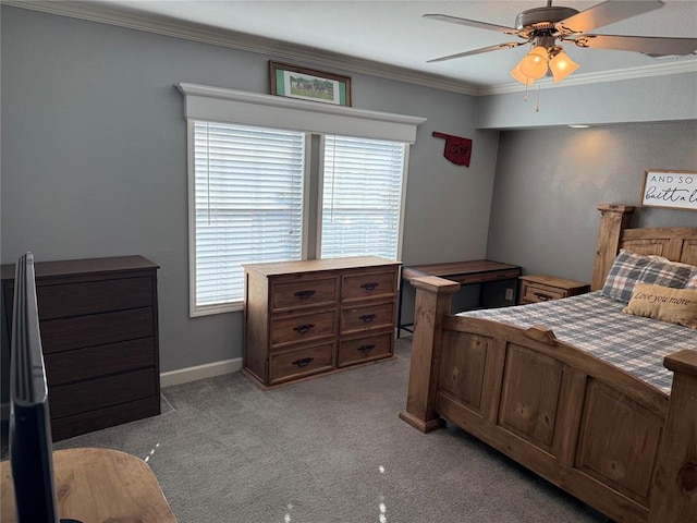 bedroom featuring ceiling fan, baseboards, light colored carpet, and crown molding
