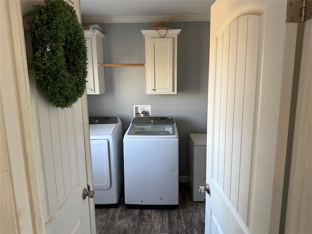 clothes washing area with cabinet space, washing machine and clothes dryer, and dark wood-style flooring