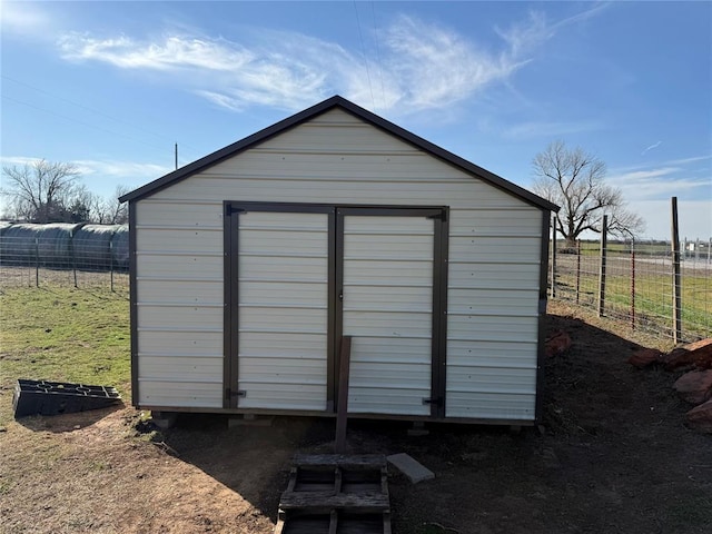 view of shed with fence