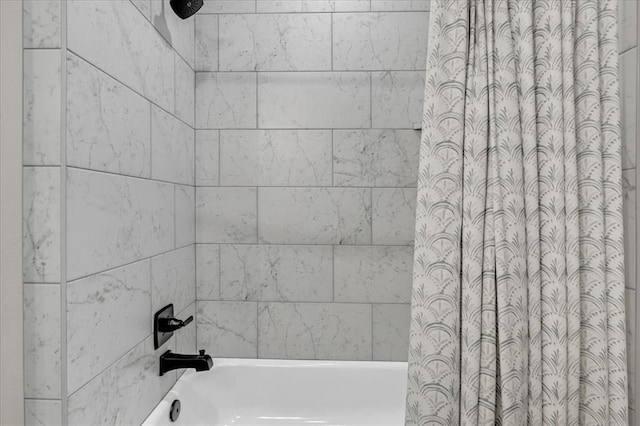 bathroom featuring shower / tub combo with curtain