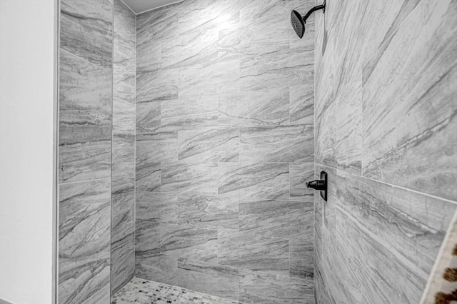 bathroom with tiled shower