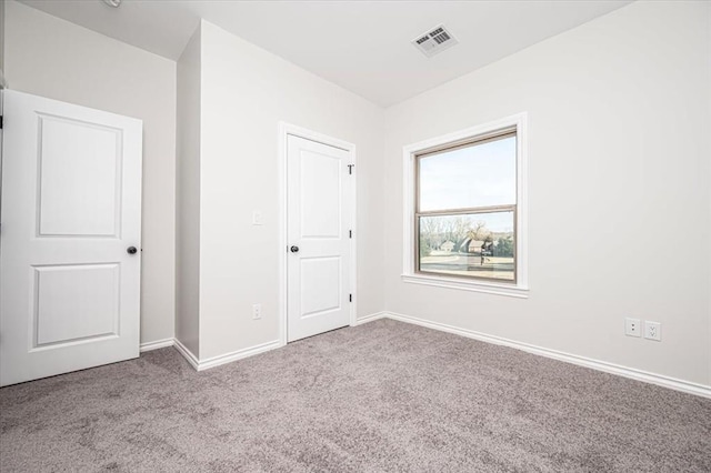 unfurnished bedroom with light colored carpet