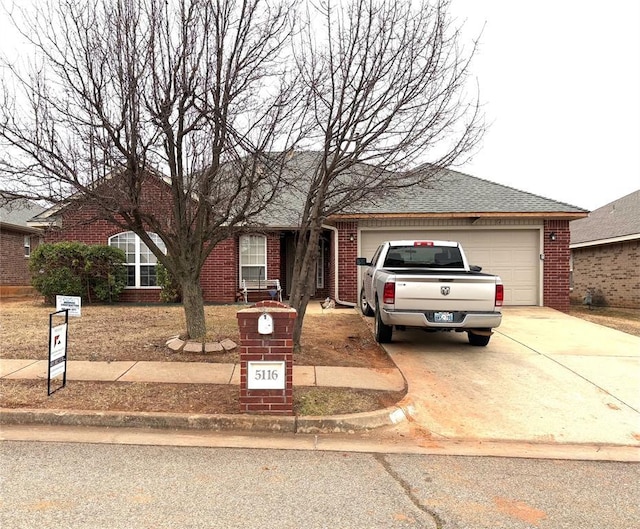 ranch-style house featuring a garage