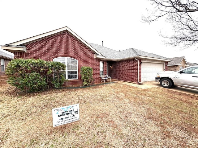 single story home featuring brick siding, driveway, a garage, and roof with shingles