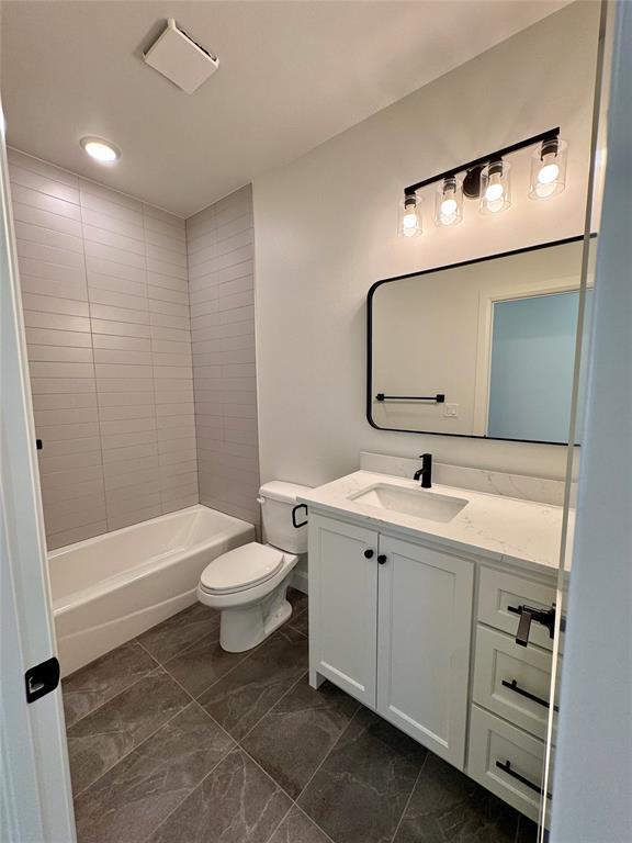 12812 Cobblestone Curve Rd, Oklahoma City, OK 73142 - full bathroom with shower / washtub combination, marble finish floor, vanity, and toilet