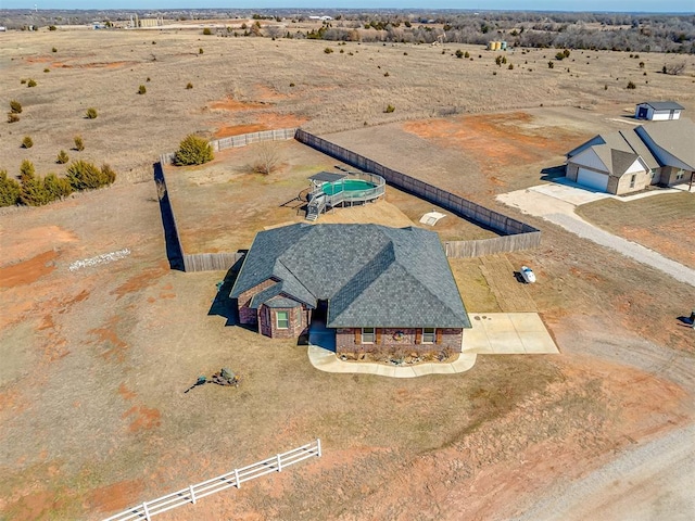 birds eye view of property with a rural view