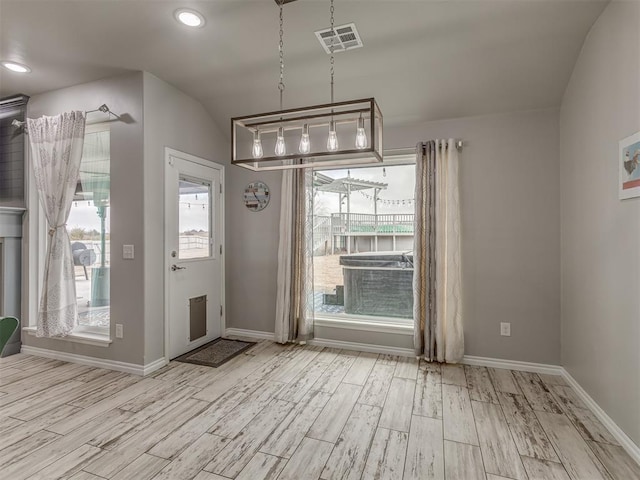 interior space featuring light wood-type flooring, visible vents, baseboards, and recessed lighting