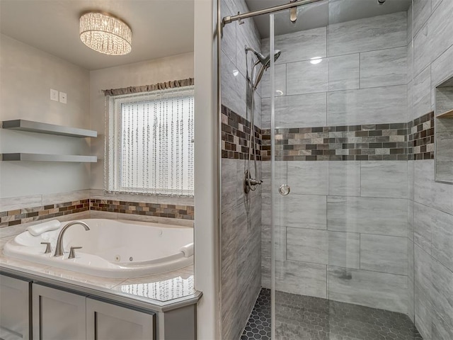 bathroom featuring a stall shower and a whirlpool tub