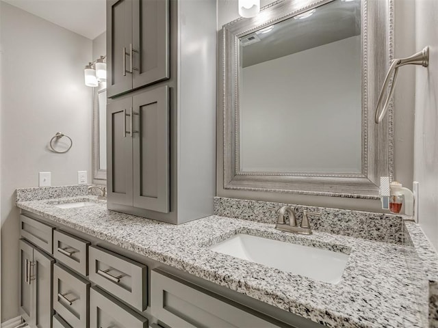 bathroom featuring double vanity and a sink