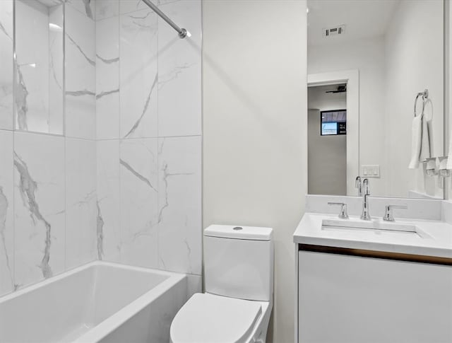 825 NW 6th St, Oklahoma City, OK 73106 - full bathroom featuring vanity, toilet, and tiled shower / bath