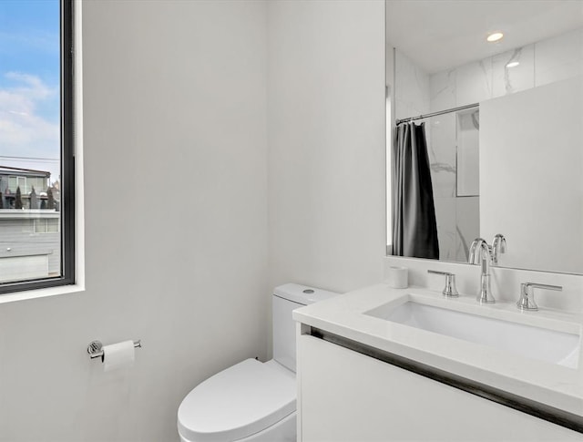 825 NW 6th St, Oklahoma City, OK 73106 - bathroom with walk in shower, vanity, and toilet