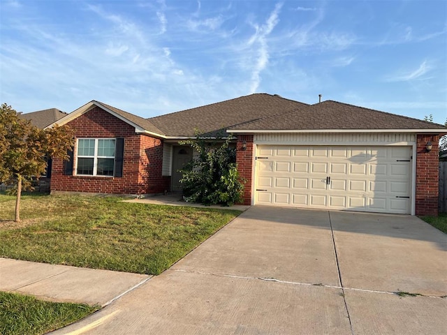 ranch-style home with a garage and a front lawn