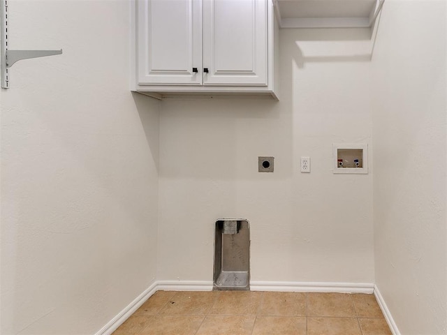 laundry room featuring washer hookup, light tile patterned floors, cabinet space, hookup for an electric dryer, and baseboards