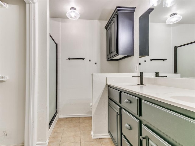 full bathroom featuring tile patterned flooring, a sink, a shower stall, and double vanity