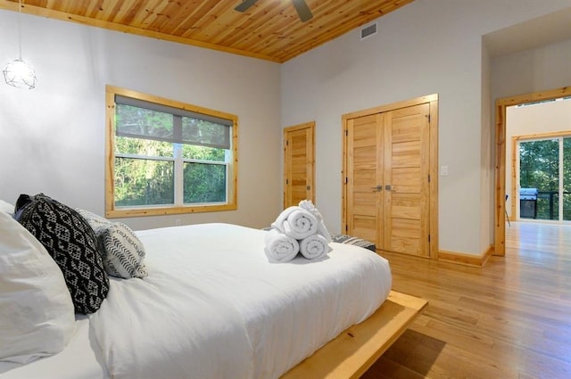 639 Woodland Hills Trl, Broken Bow, OK 74728 - bedroom with wooden ceiling, light hardwood / wood-style floors, and ceiling fan