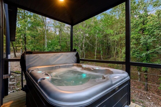 639 Woodland Hills Trl, Broken Bow, OK 74728 - sunroom / solarium featuring a jacuzzi