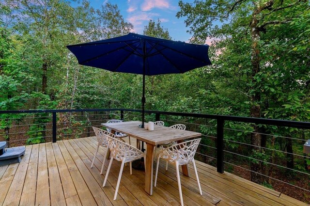 639 Woodland Hills Trl, Broken Bow, OK 74728 - view of deck at dusk