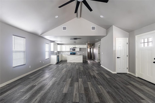 unfurnished living room with dark wood-type flooring, ceiling fan, high vaulted ceiling, and beamed ceiling