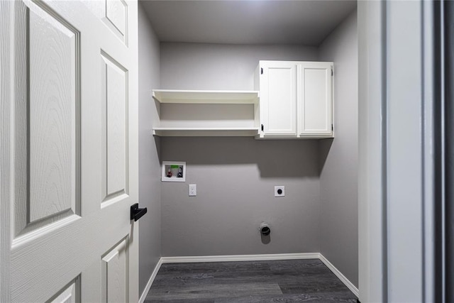 washroom with dark wood-type flooring, cabinets, hookup for an electric dryer, and hookup for a washing machine