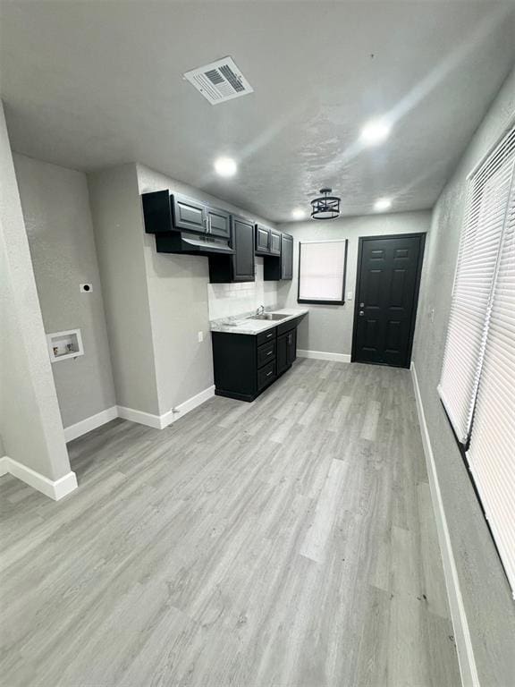 kitchen with sink and light wood-type flooring