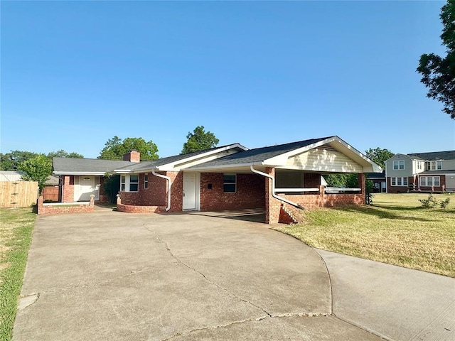 single story home featuring a front lawn