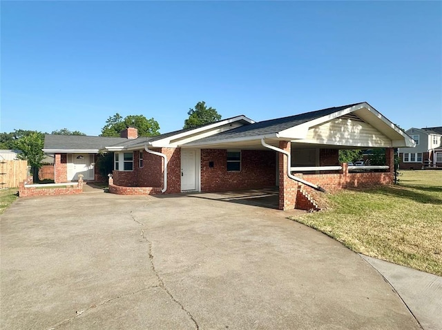 single story home featuring a front yard and a carport