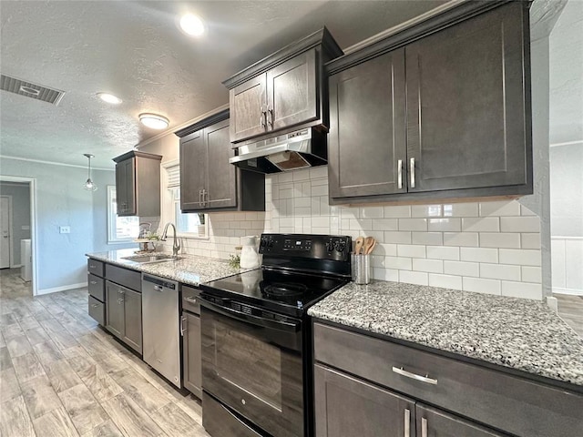 kitchen featuring black electric range oven, sink, light wood-type flooring, dishwasher, and decorative backsplash