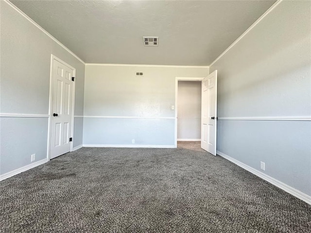 carpeted spare room with crown molding