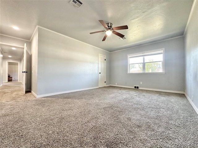 unfurnished room featuring crown molding, ceiling fan, and carpet flooring