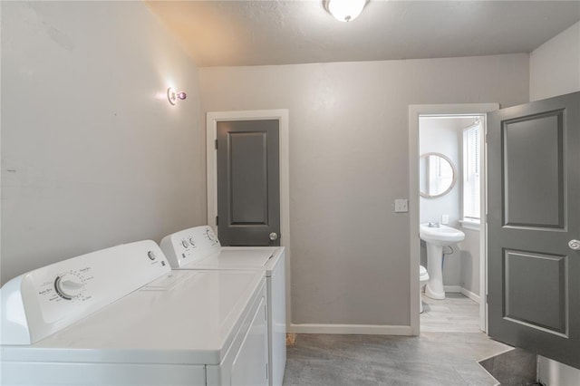 laundry room with sink and washer and dryer