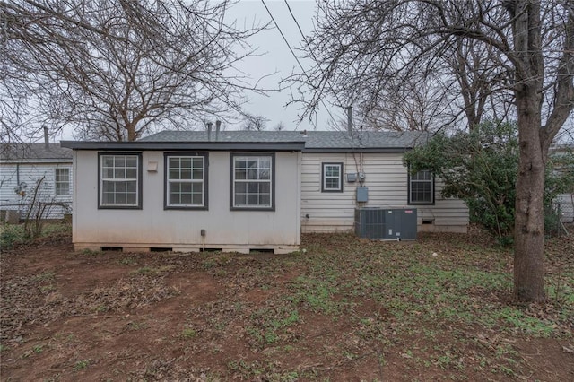 back of property with central air condition unit